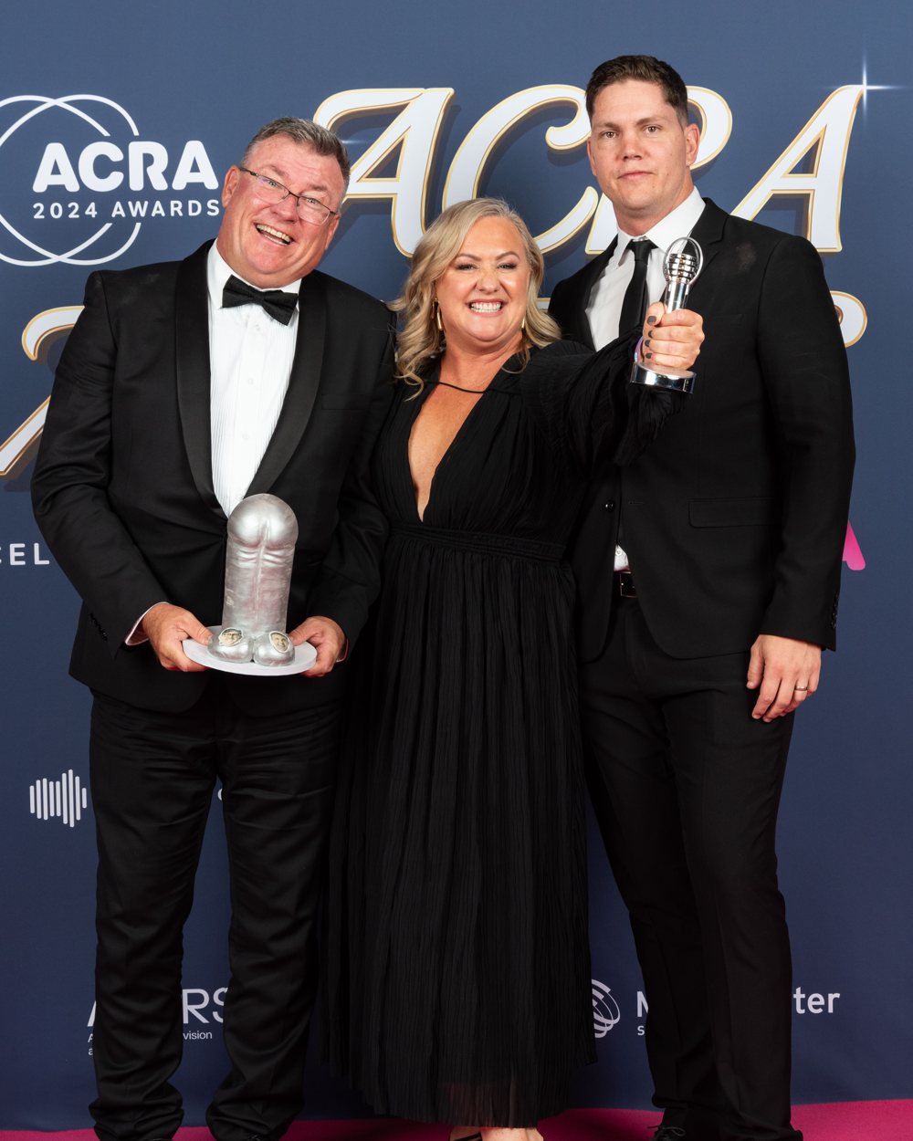 Ali Plath on the pink carpet at the 2024 ACRAs with the Best On Air Team (Provincial) award