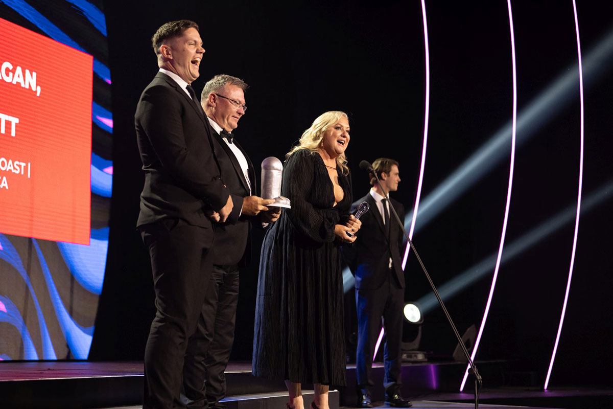 Alison Plath on stage accepting the ACRA for Best On Air Team, Provincial, 2024