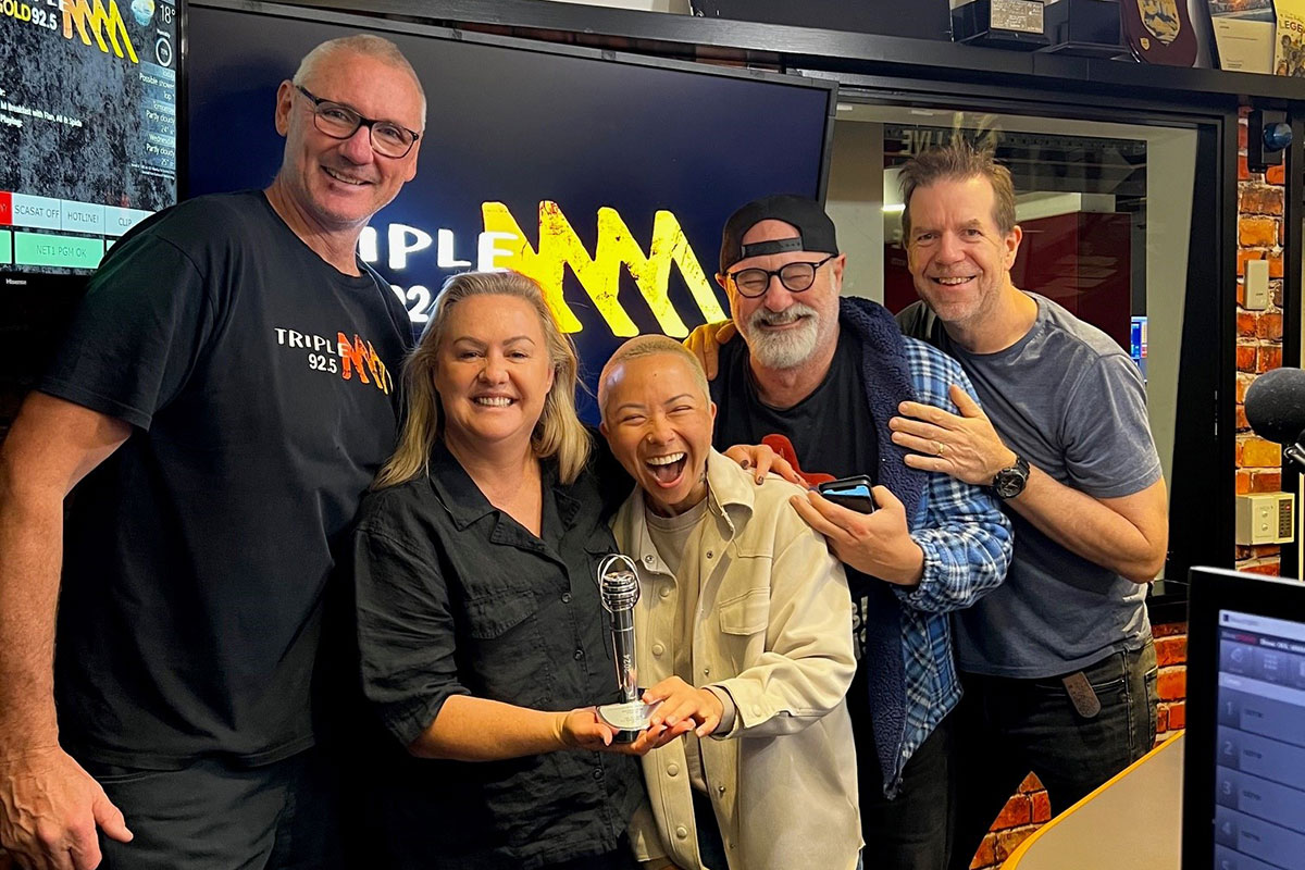 The 92.5 Triple M Gold Coast breakfast team in studio with their ACRA award